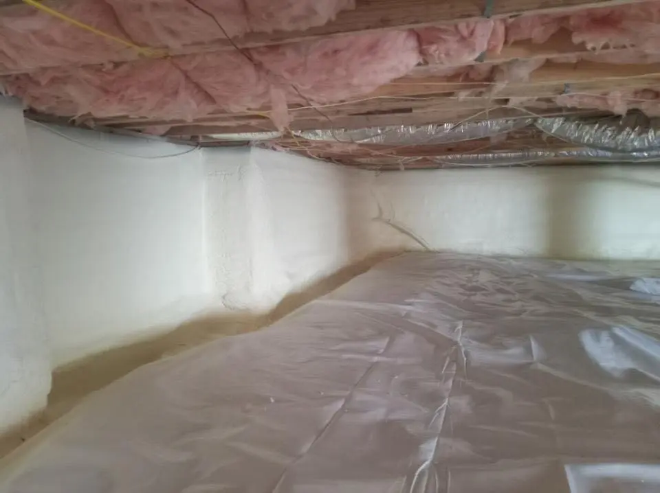 Crawl space encapsulation with closed-cell spray foam for Commercial Roof Restoration in Metropolis